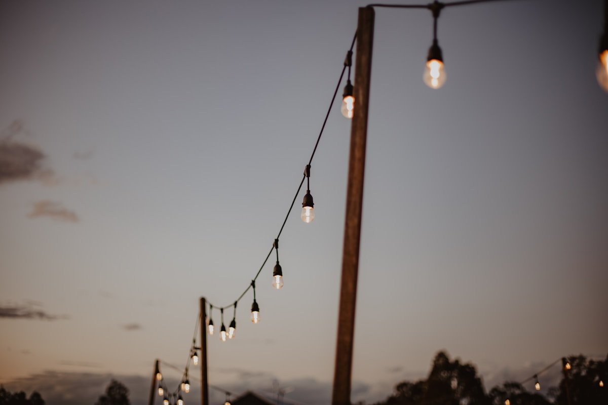 Warm Pendant Lights Inside Wedding Tent — Ultimate Party Rentals